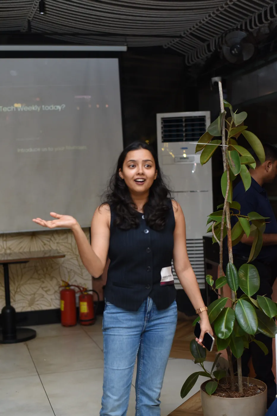 A founder speaking at the FTW Roadshow in Mumbai, in front of a slide that reads Introduce us to your founders